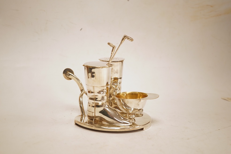 A novelty horse-related cruet stand, a pair of silver mounted horn beakers and three other items